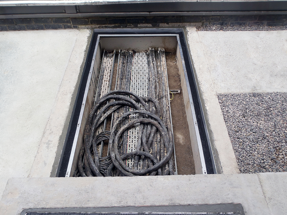 Aluminium frame set into existing steel frame with epoxy grout.