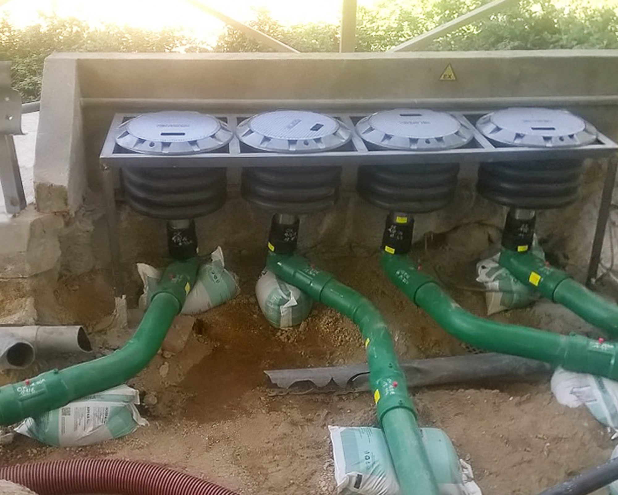 Cast iron chambers often have to be fixed in a frame and piping supported (pictured: different site to show possible frame configuration)