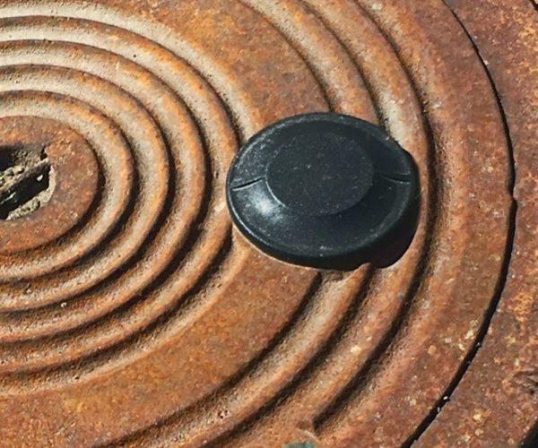 Previously installed metal covers exposed the antenna above the cover in order for the system to work