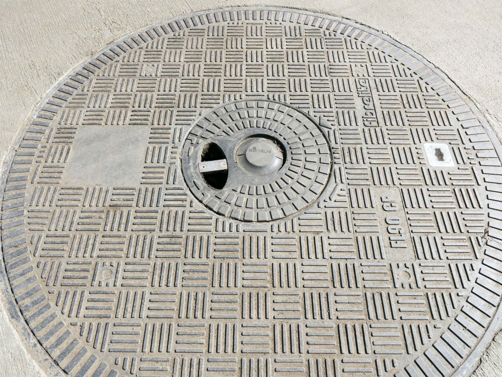 Fibrelite composite cover molded with central recess, designed to embed RF antenna in top surface of the cover