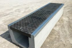 Precast concrete trench systems including Fibrelite covers