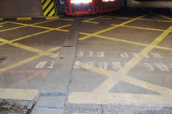 Previously installed covers were poorly fitting in their frames due to the covers being distorted.