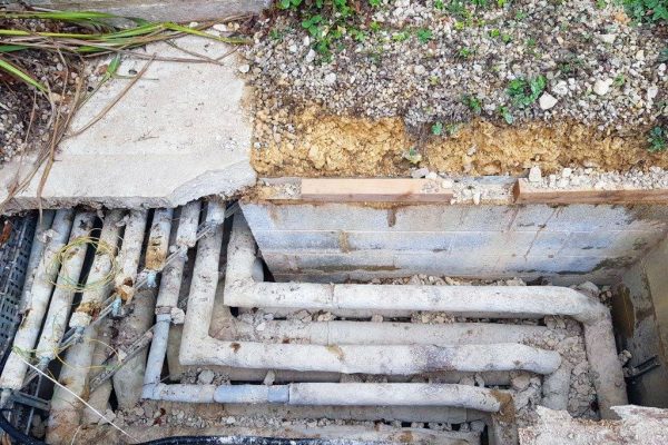 Previously installed concrete covers had fractured and chipped
