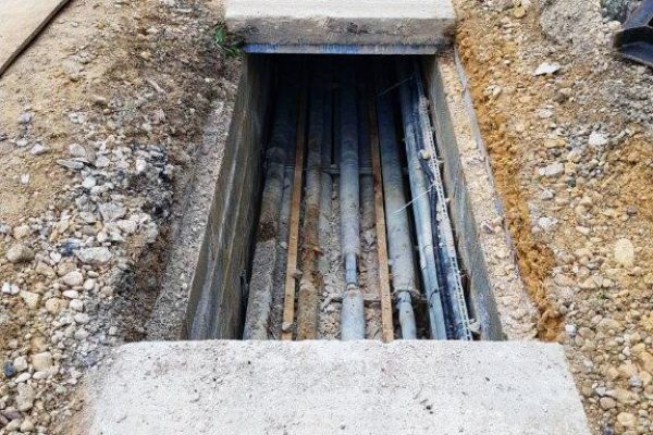 Fractured covers had allowed dust and debris to enter the trench