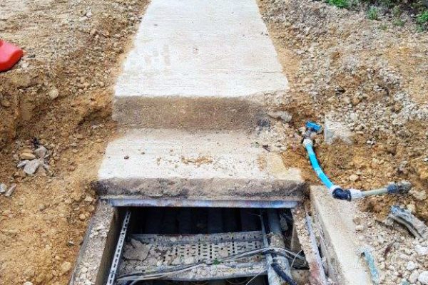 Concrete covers posed a risk of injury to maintenance workers due to their weight